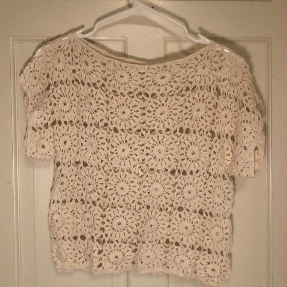 Cream color knit top.